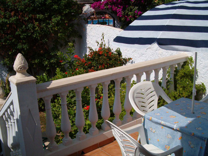 Raised terrace and garden with view to pool