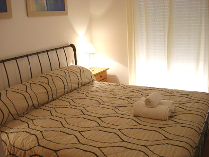 Master bedroom with ensuite bathroom and balcony