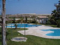 Swimming pool area of studio apartment for rent in Torrox Costa - click for details